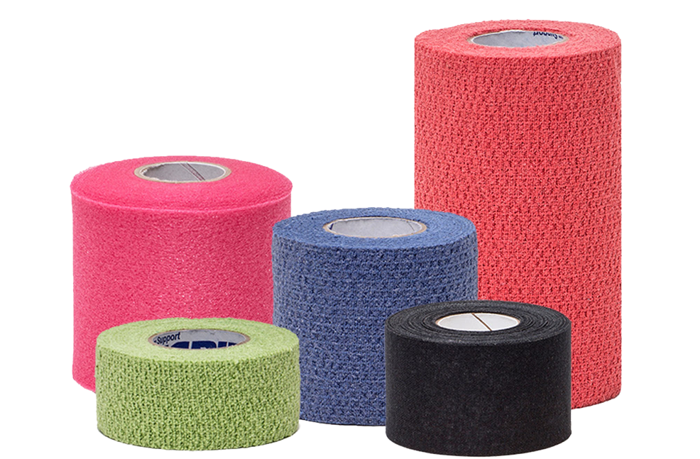 Five rolls of cohesive bandage tape in different colors—pink, red, green, blue, and black—are arranged upright on a plain white background. The rolls vary in height and width.
