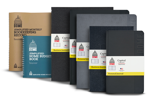 A variety of Dome-brand financial record books and journals, including bookkeeping, home budget, business journals, and personal journals, displayed upright in a row against a white background.